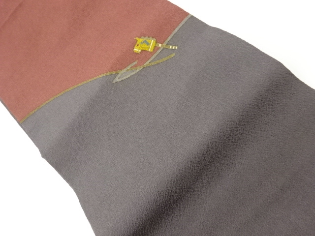 縮緬地竹馬張り子模様刺繍名古屋帯